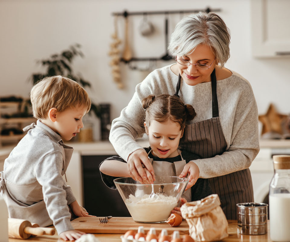 Image showing a grandmother baking with her grandchildren
