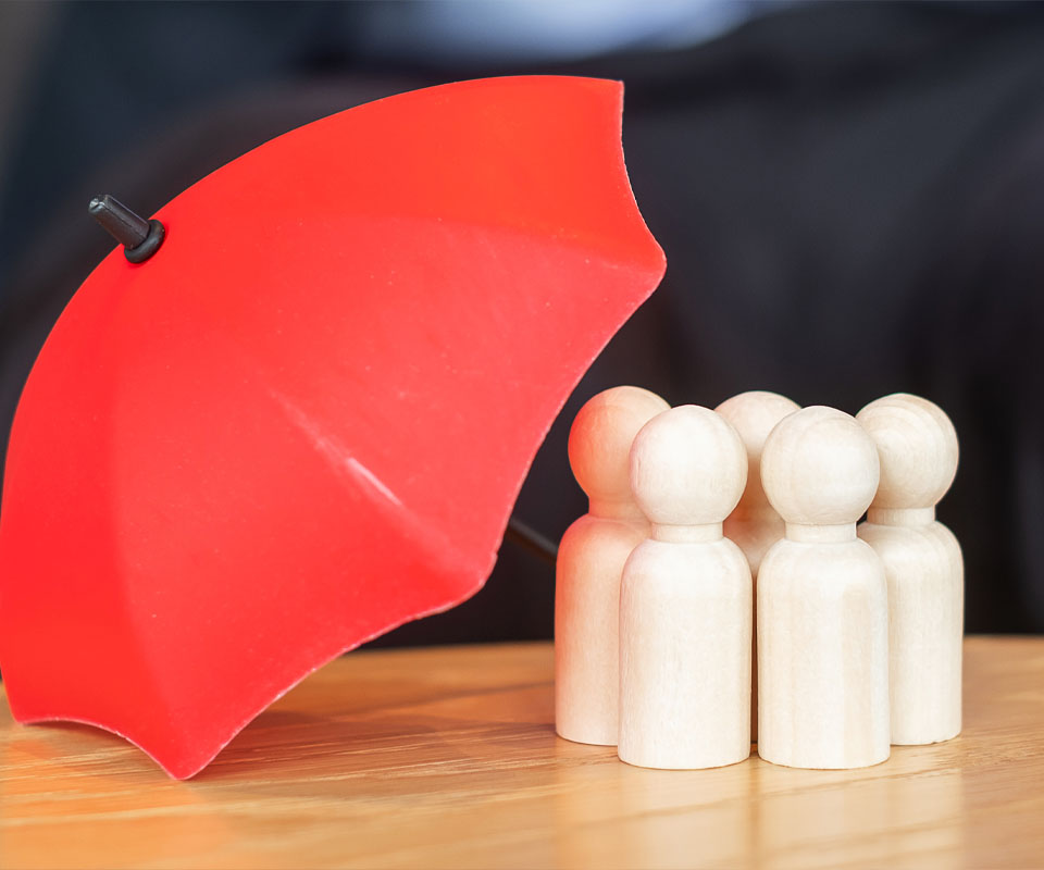 Image showing a close up of some model people being protected by a small plastic umbrella