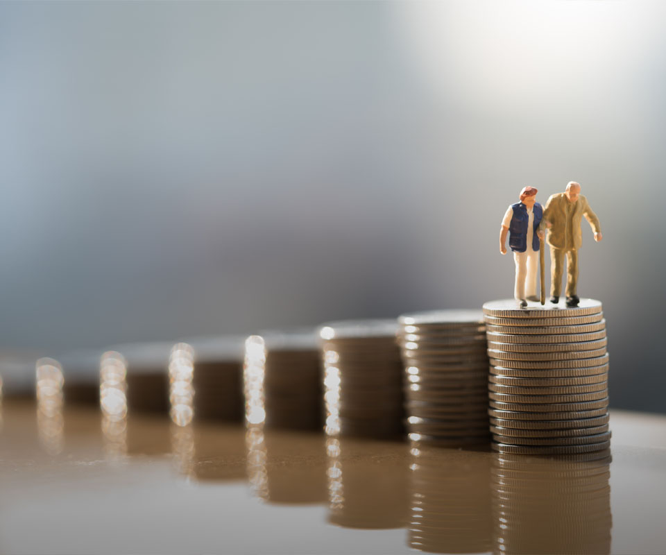 Image showing a model of an elderly couple standing on some piles of coins
