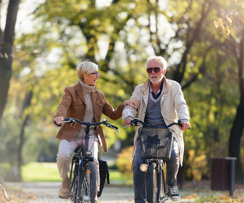 Image showing an older couple cycling together