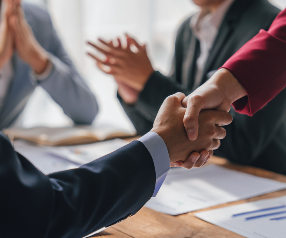 Image showing a close up of people shaking hands during a business meeting
