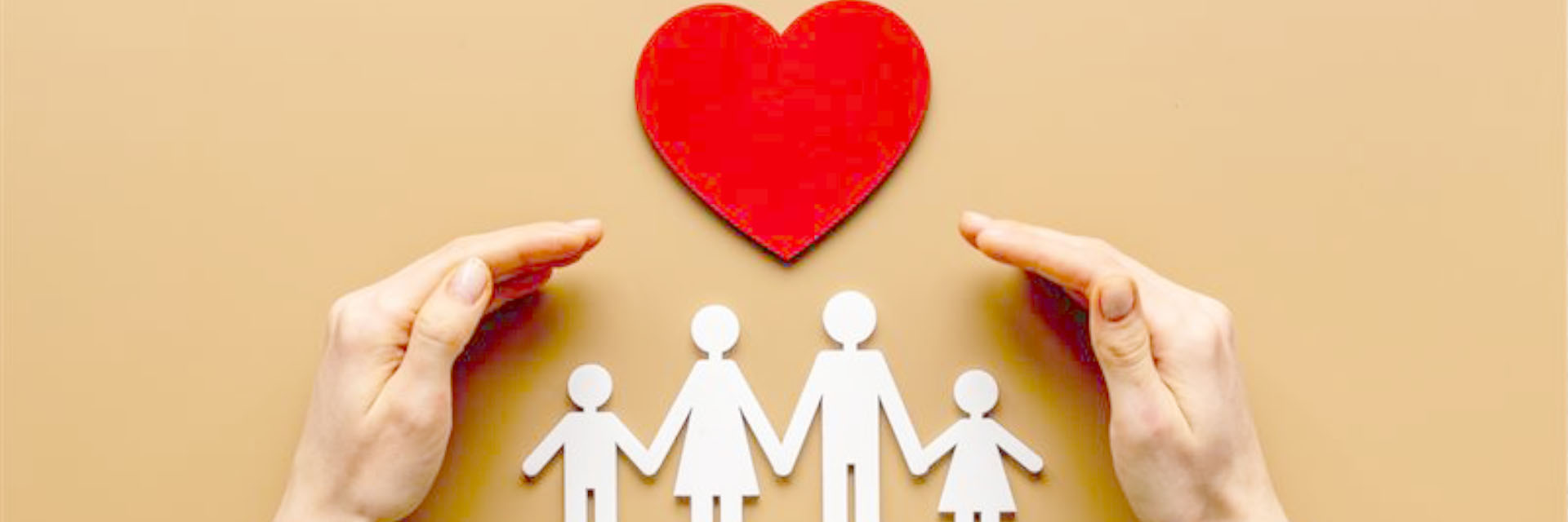 Photo of a paper family with a red heart above being protected by a hand on either side