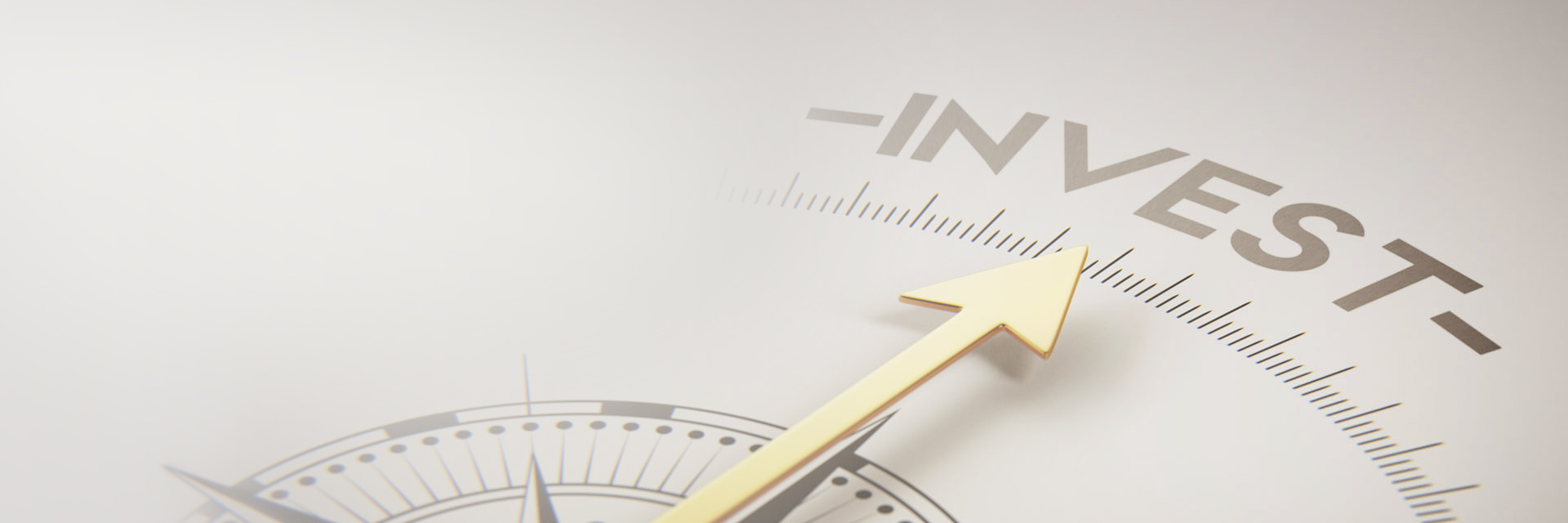 Image showing a close up of a compass pointing to the word "invest"
