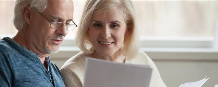 Image showing an older couple looking at some paperwork together