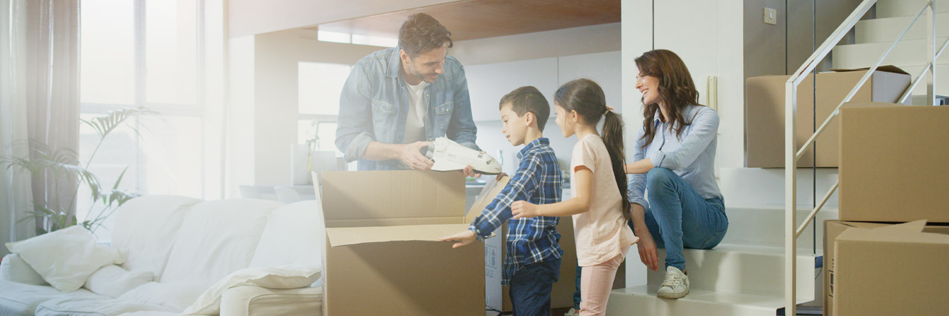 Image showing a family unpacking boxes together
