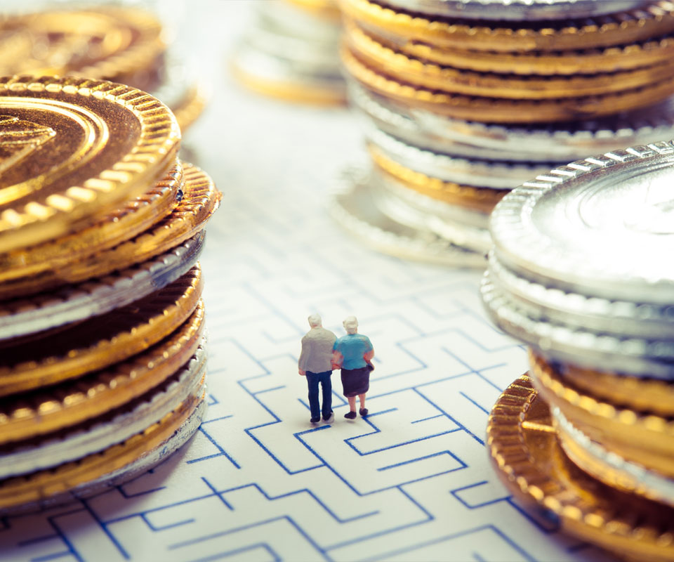 Image showing a model of an older couple in a maze surrounded by large piles of coins