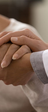 Image showing a close up of a patient's hand being held by a doctor