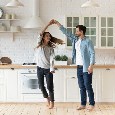Image showing a young couple dancing in their kitchen