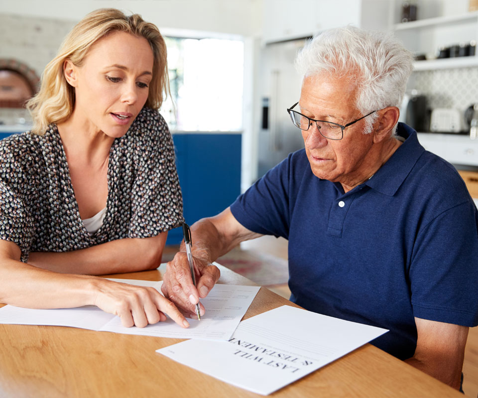 Image showing a young woman helping an older man with his will