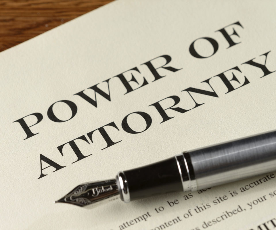Image showing a document titled "Power of attorney" with a fountain pen on top