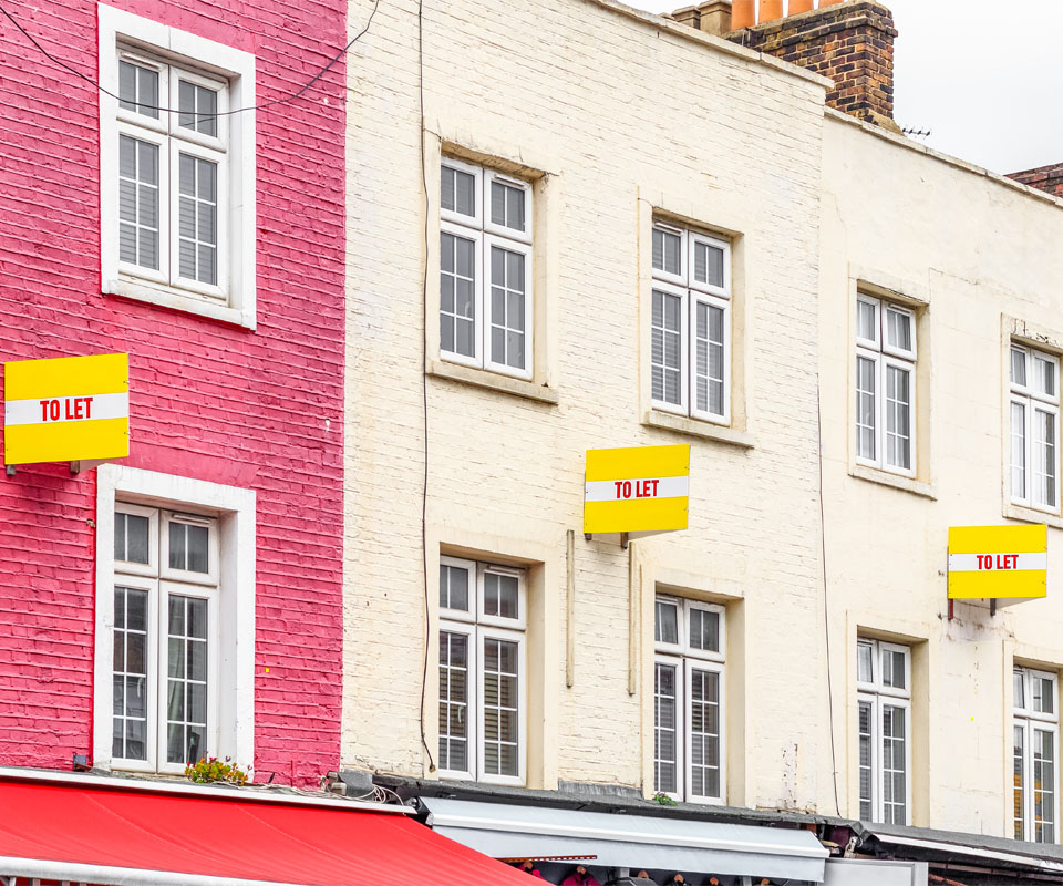 Image showing a row of house with "To let" signs outside