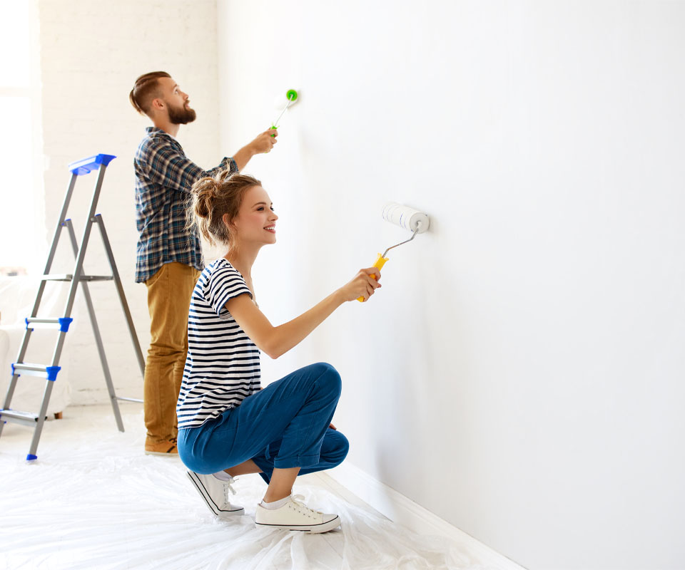 Image showing a young couple painting a wall