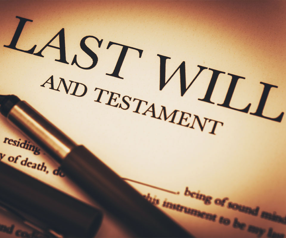 Image showing a document titled "Last will and testament" with a fountain pen on top