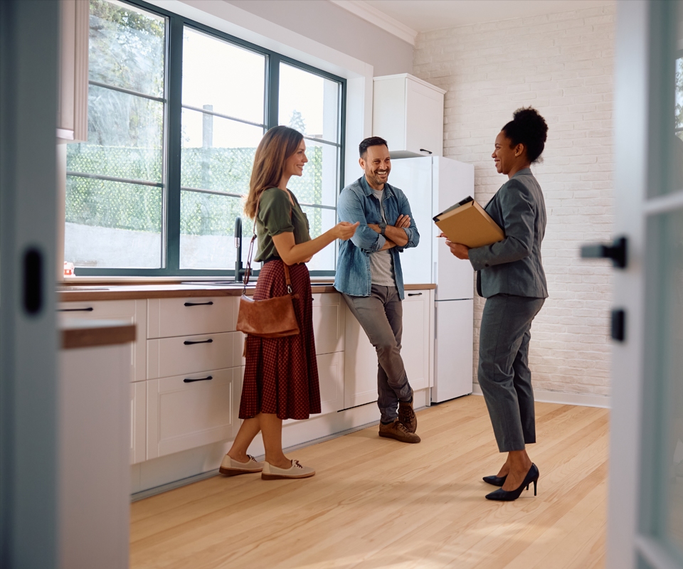 Image showing happy couple talking with real estate agent while buying new home