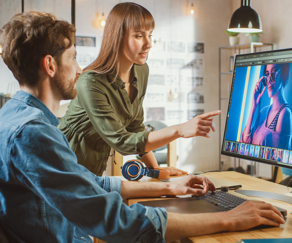 Image showing female art director consults designer colleague